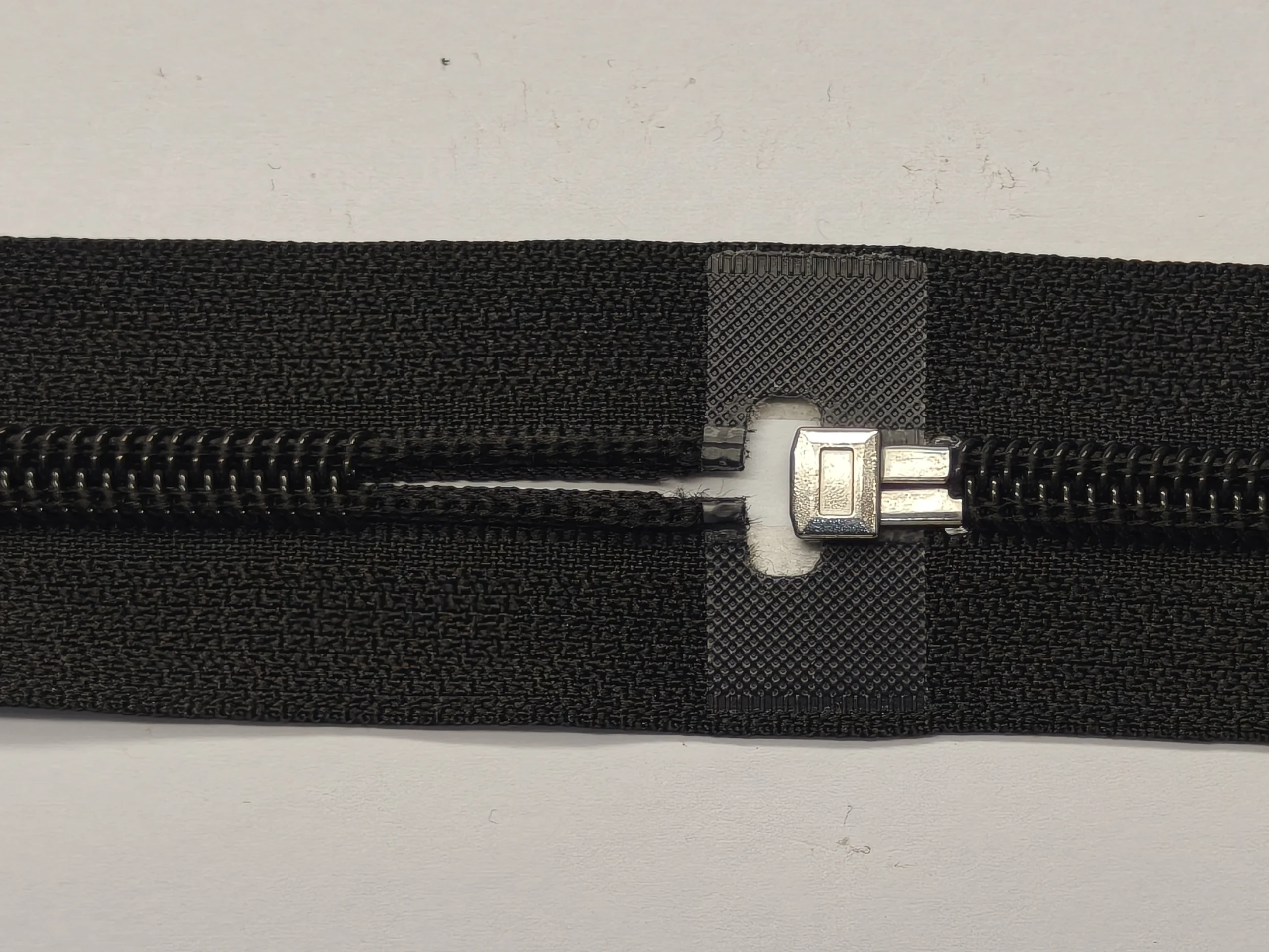 Square pin and box component on an open-end zipper